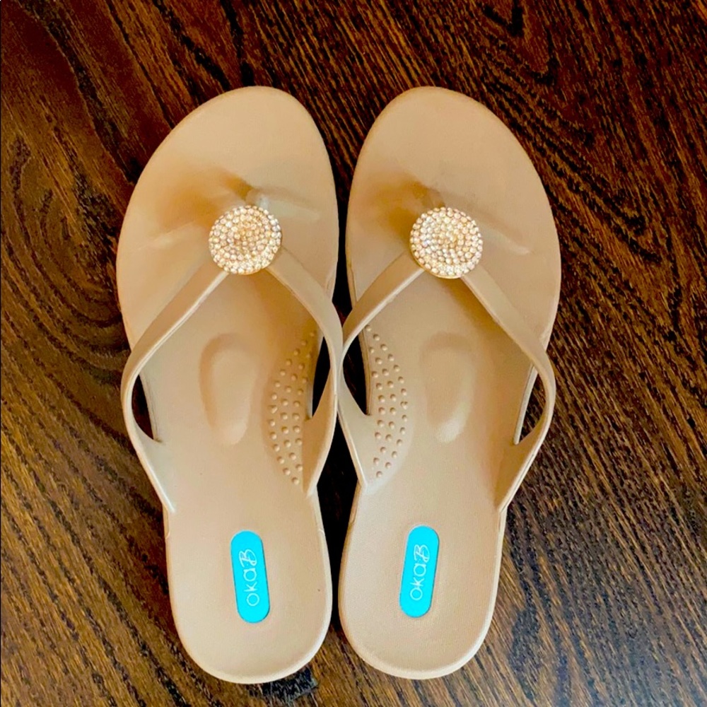 Oka B sand colored flip flops